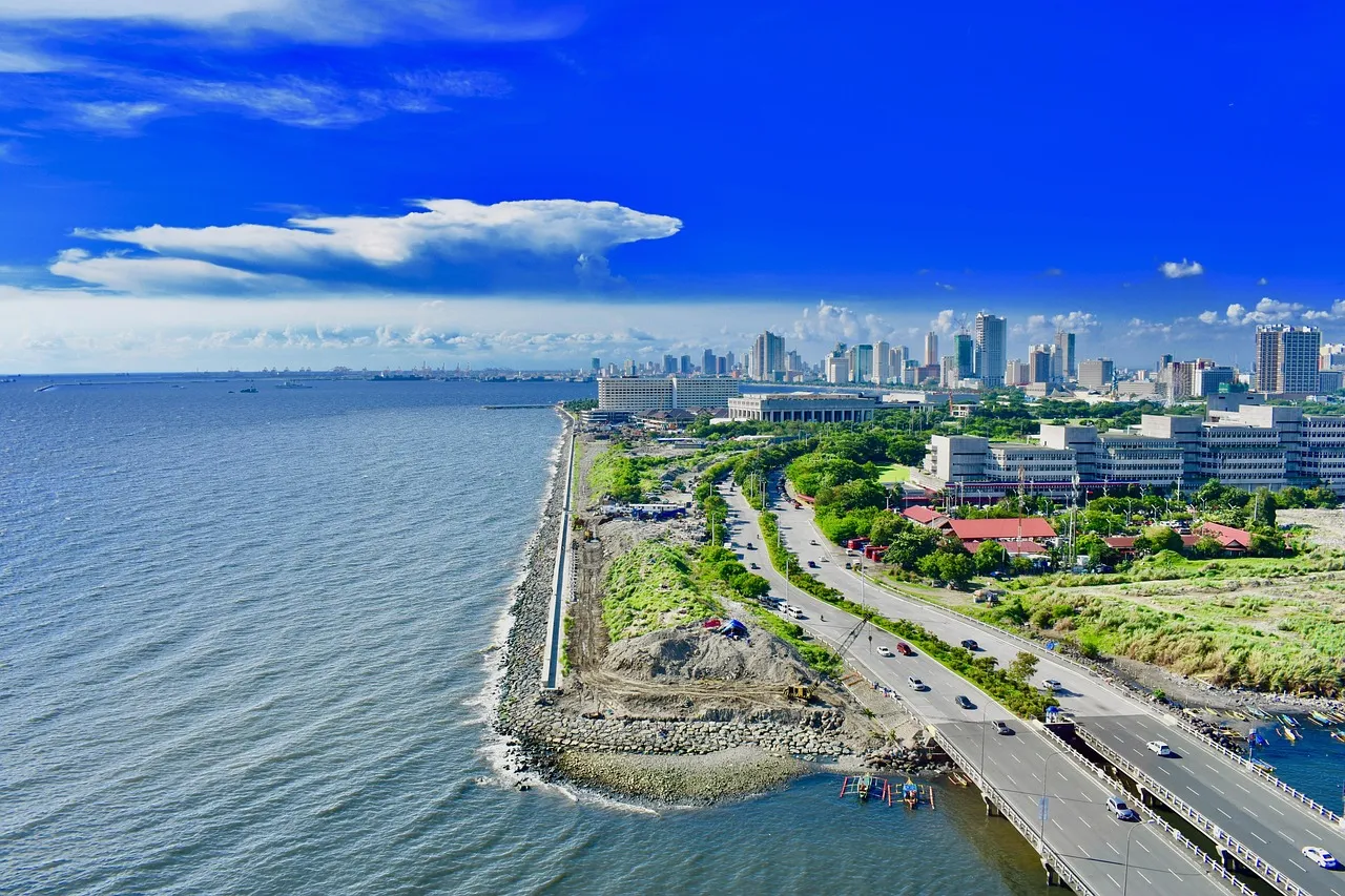 Manila Bay seen from above, with the city skyline along the shore