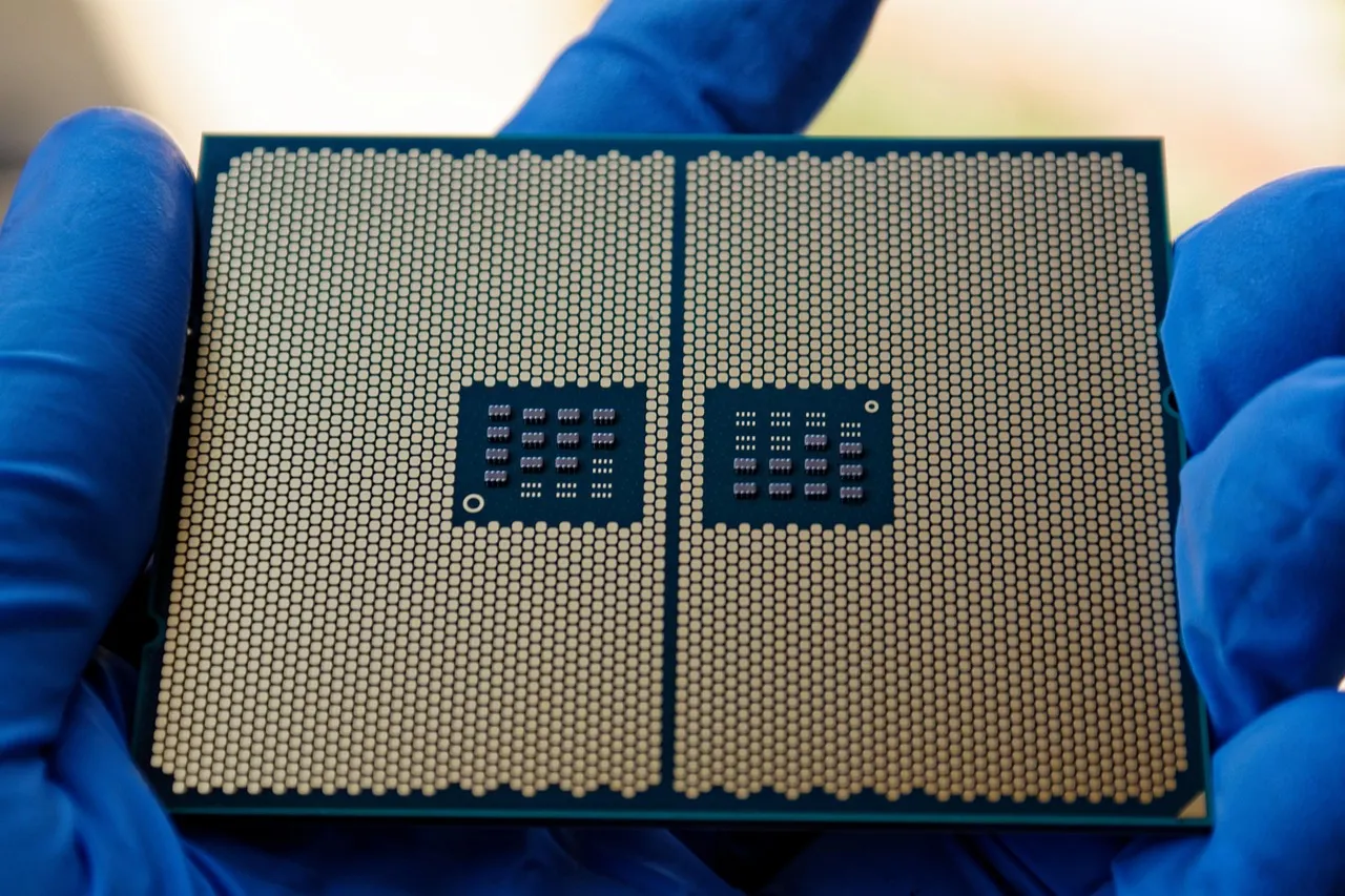 Gloved hands holding a large processor package, illustrating a report on Nvidia's talks with the Korean inference chip designer Rebellions.