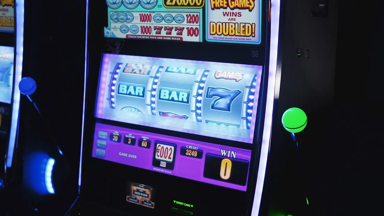 A slot machine screen advertising doubled free games, with the win counter reading zero