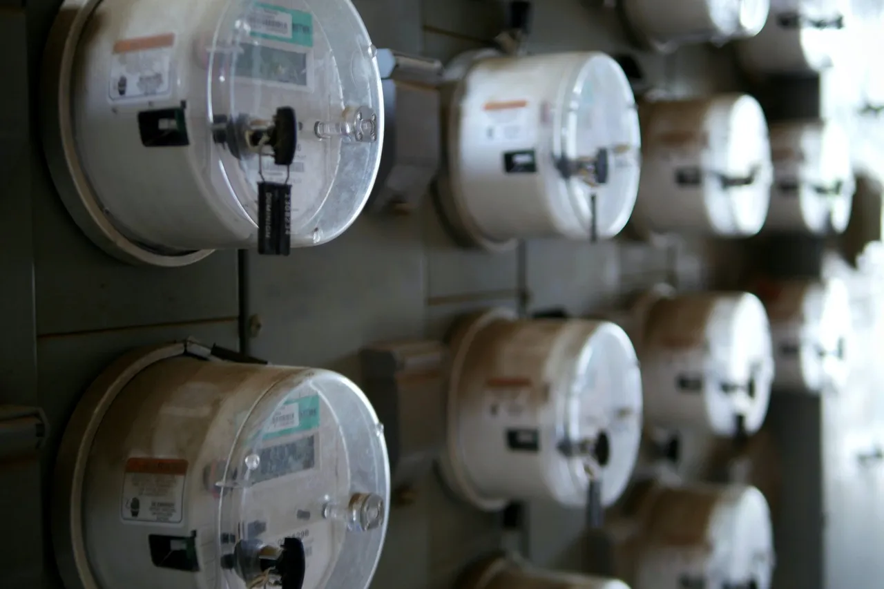 A wall of electricity meters mounted in rows
