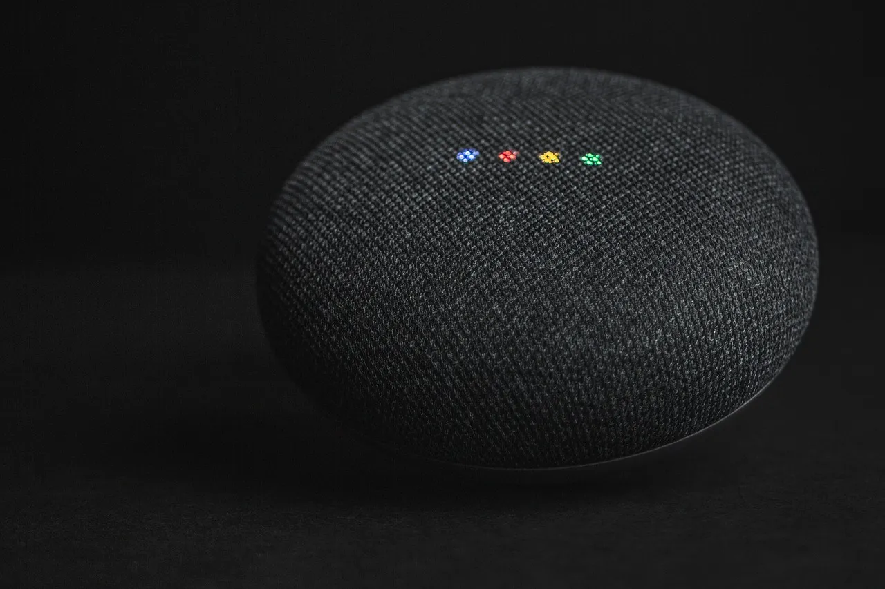 A small smart speaker sitting on a table.