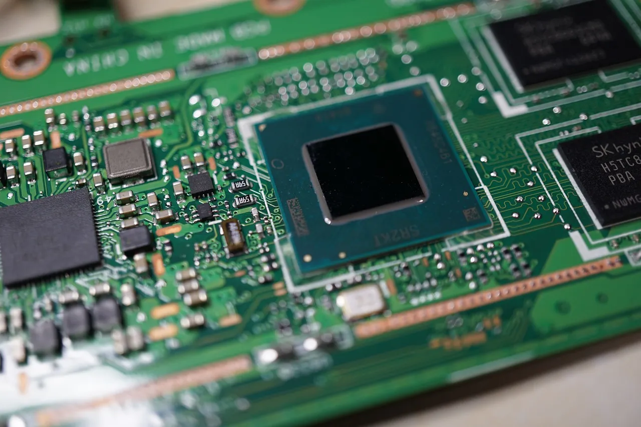 A close-up of a printed circuit board with a country-of-origin marking silkscreened on it