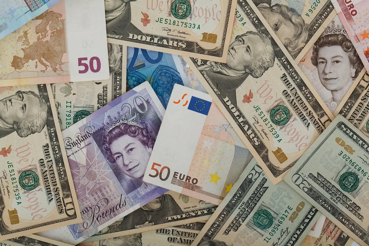 Banknotes from several different countries spread out together