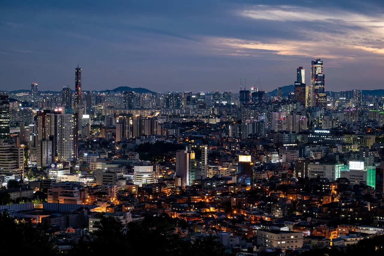 A dense city skyline at dusk, in a market where consumer AI subscriptions are growing quickly