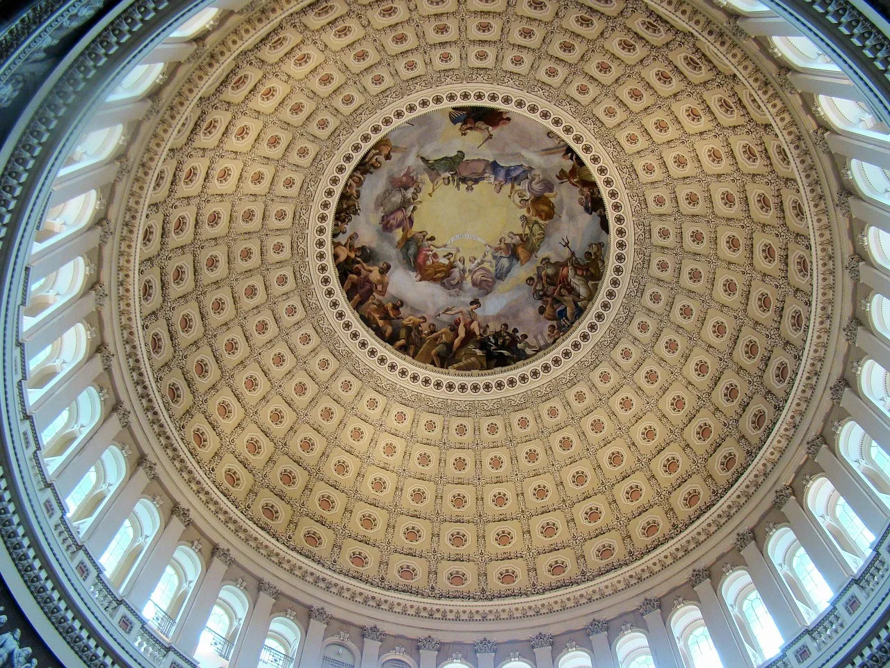 Looking straight up into the interior of the United States Capitol dome, at its rings of coffered panels and the circular fresco at the centre.