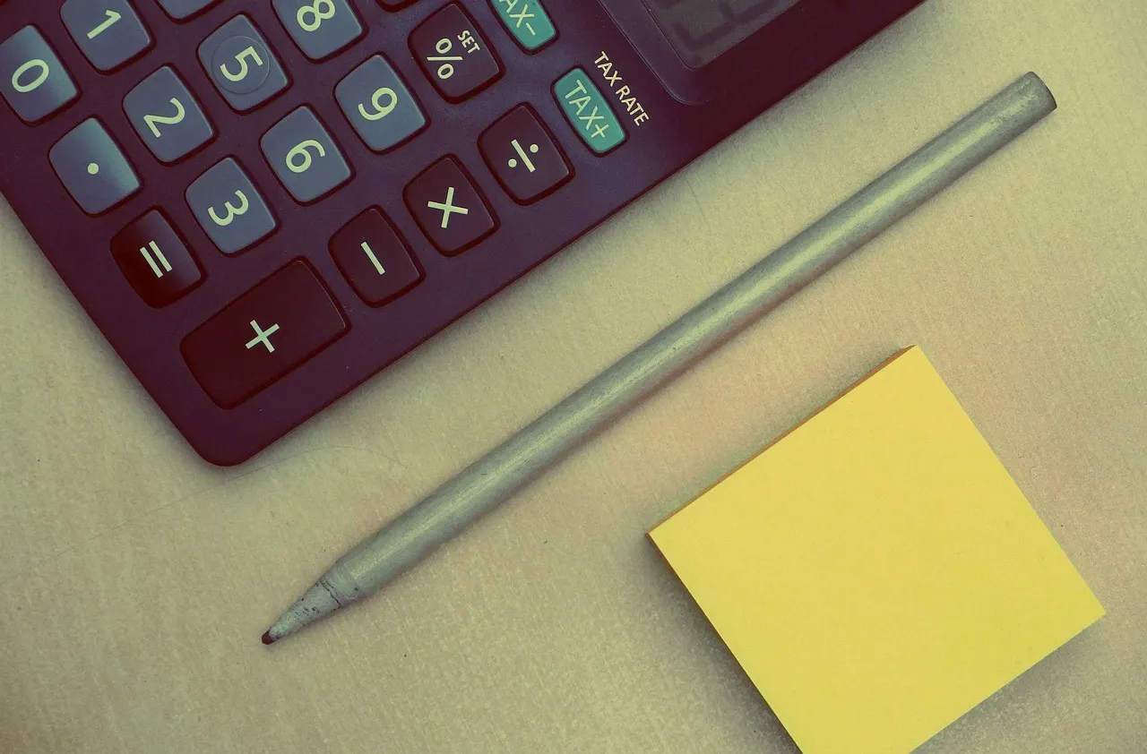A calculator keypad with the percentage key clearly visible, beside a pencil and a blank sticky note — illustrative of the arithmetic this article does on a widely repeated percentage.