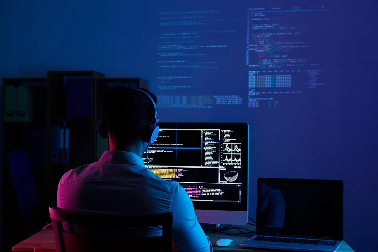 A software developer working at a computer.